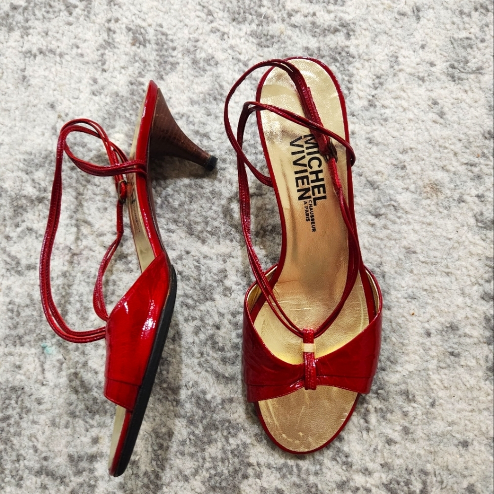 Michel Vivien red patent heel pump.